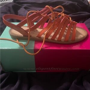 Brand new with original box orange tie up sandals